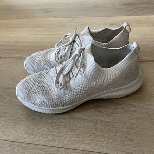 Well worn white sneakers